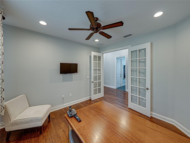 interior space with visible vents, baseboards, recessed lighting, french doors, and wood finished floors