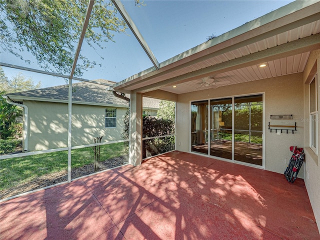 exterior space with beamed ceiling and a ceiling fan