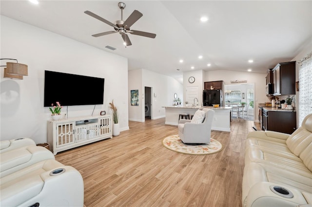 living room featuring visible vents, ceiling fan, vaulted ceiling, light wood-style floors, and recessed lighting