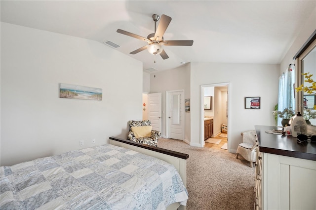 bedroom with lofted ceiling, light carpet, visible vents, and baseboards