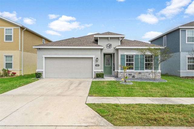 view of front of house featuring driveway, a shingled roof, an attached garage, a front yard, and stucco siding