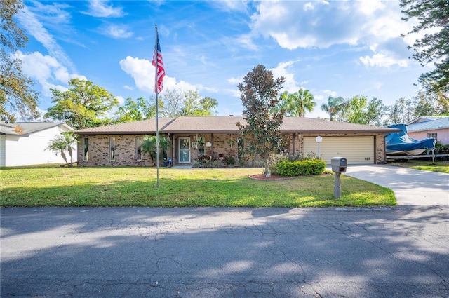 ranch-style home featuring an attached garage, brick siding, driveway, and a front lawn