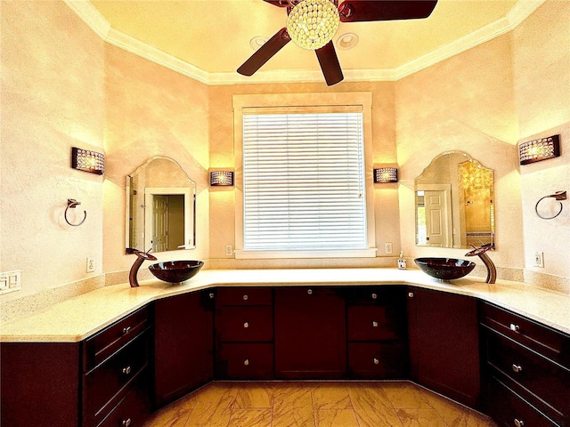 full bathroom featuring crown molding, marble finish floor, and a sink