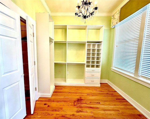 interior space featuring a chandelier and wood finished floors