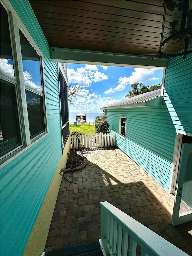 view of patio featuring a water view