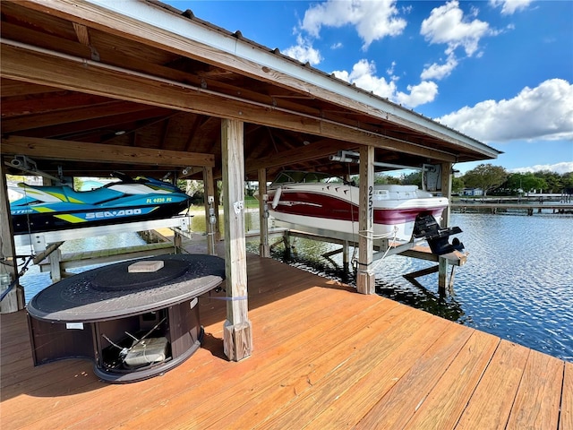 view of dock with a water view and boat lift