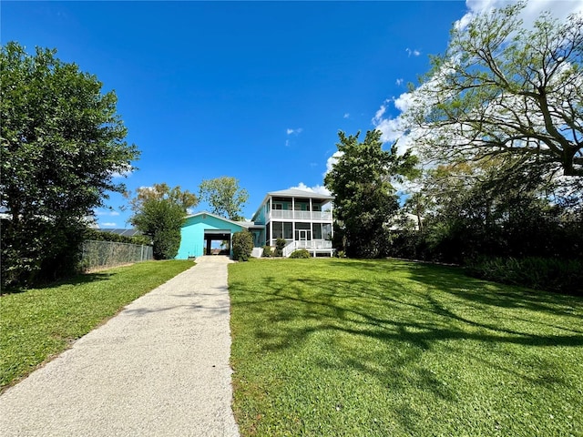 view of front of home with a garage, fence, concrete driveway, and a front yard