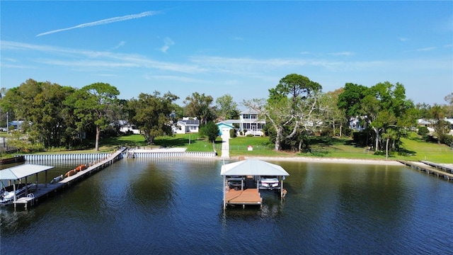 dock area with a water view and boat lift