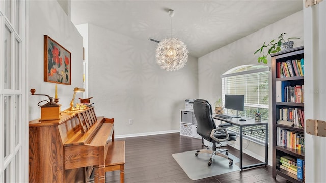 home office with an inviting chandelier, visible vents, baseboards, and wood finished floors