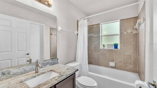 full bathroom with toilet, shower / tub combo with curtain, and vanity