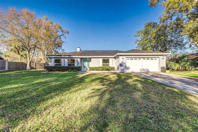 single story home with an attached garage, fence, a front lawn, and concrete driveway