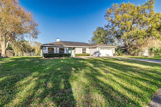 ranch-style home featuring a garage, a front yard, fence, and a chimney