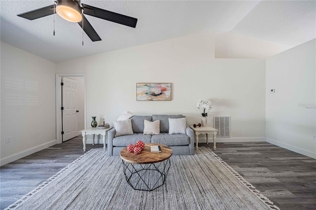 living room with visible vents, a ceiling fan, a textured ceiling, wood finished floors, and lofted ceiling