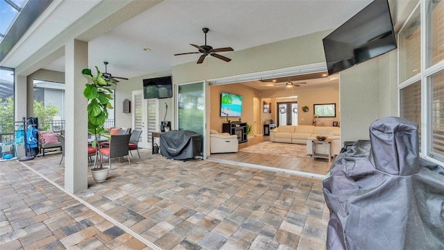 view of patio / terrace featuring french doors, outdoor lounge area, and a ceiling fan