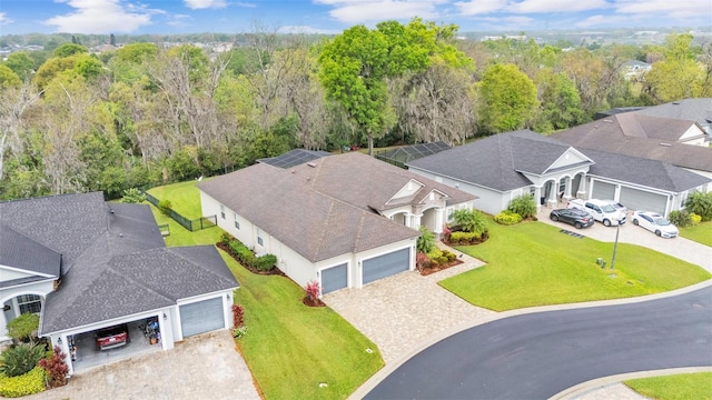 aerial view featuring a wooded view