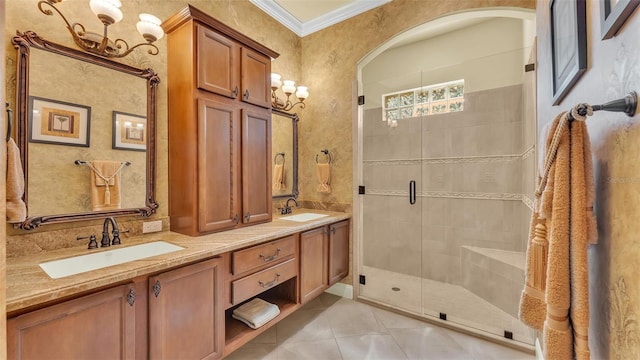 bathroom featuring tile patterned flooring, a sink, ornamental molding, a shower stall, and double vanity