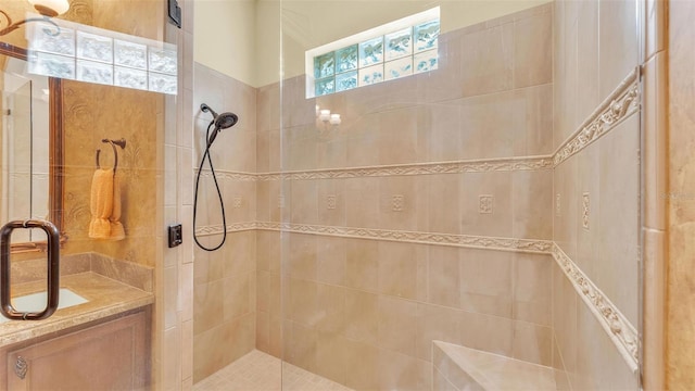 full bath featuring a tile shower