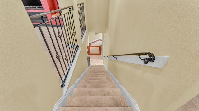 staircase with baseboards