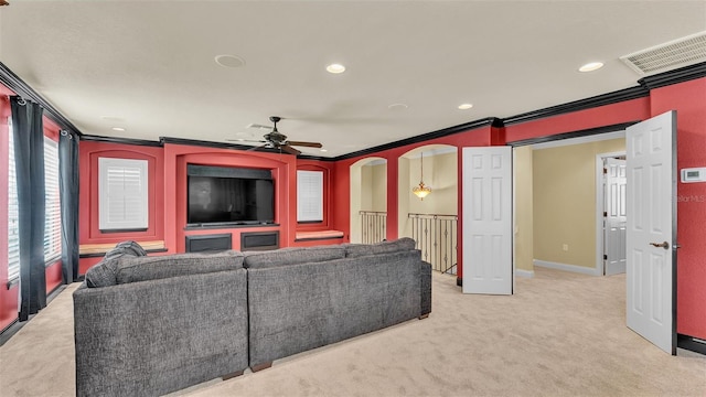 home theater with crown molding, recessed lighting, visible vents, light carpet, and baseboards