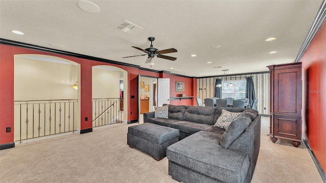 living area featuring visible vents, ornamental molding, and light colored carpet