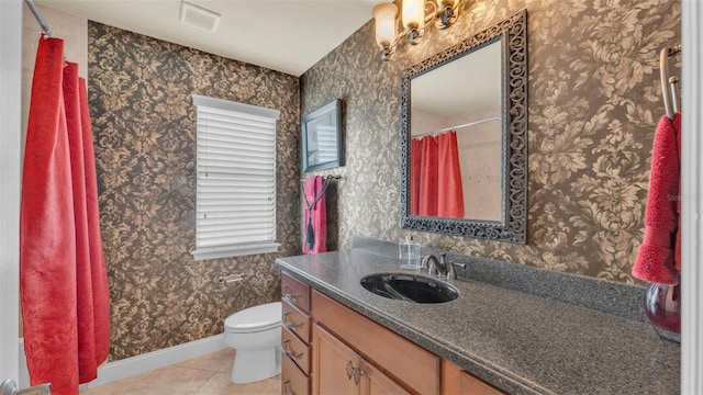 bathroom featuring wallpapered walls, baseboards, toilet, tile patterned floors, and vanity