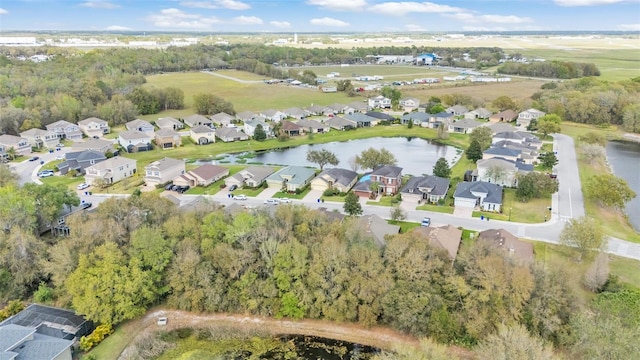 birds eye view of property featuring a water view and a residential view