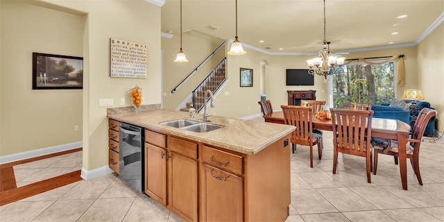 kitchen featuring light tile patterned floors, dishwashing machine, a sink, baseboards, and ornamental molding