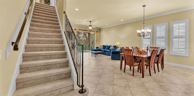 dining room featuring ornamental molding, baseboards, and light tile patterned floors