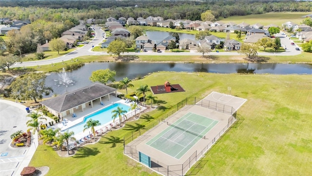 drone / aerial view with a residential view and a water view