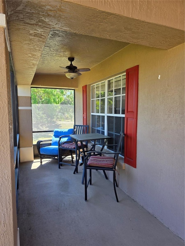 view of patio with a porch and a ceiling fan