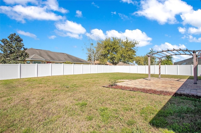 view of yard featuring a patio area, a pergola, and a fenced backyard