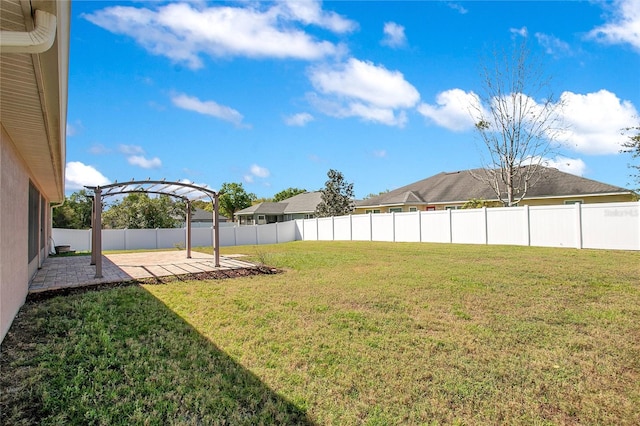 view of yard with a patio area, a pergola, and a fenced backyard