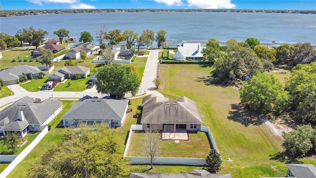 birds eye view of property featuring a residential view and a water view