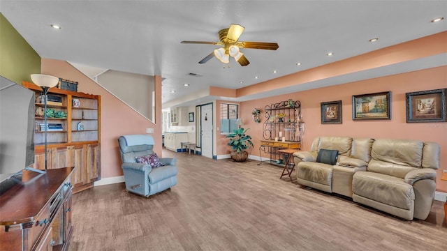 living room with recessed lighting, visible vents, a ceiling fan, wood finished floors, and baseboards