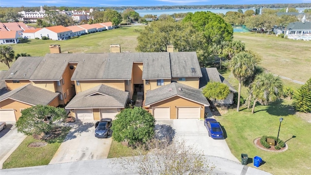 aerial view featuring a water view and a residential view