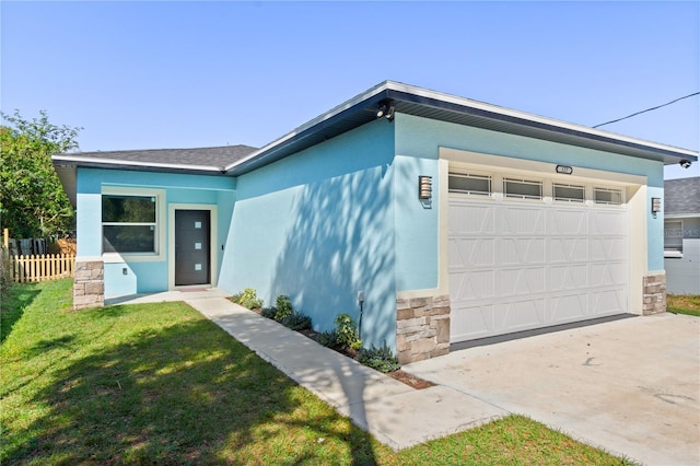 view of front facade featuring a front lawn, fence, stucco siding, stone siding, and an attached garage