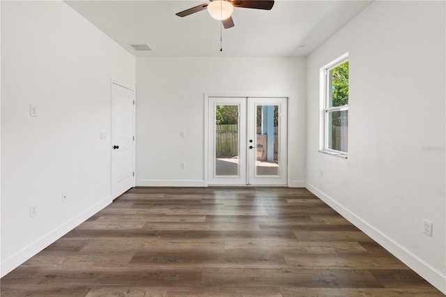 unfurnished room with french doors, baseboards, wood finished floors, and a ceiling fan