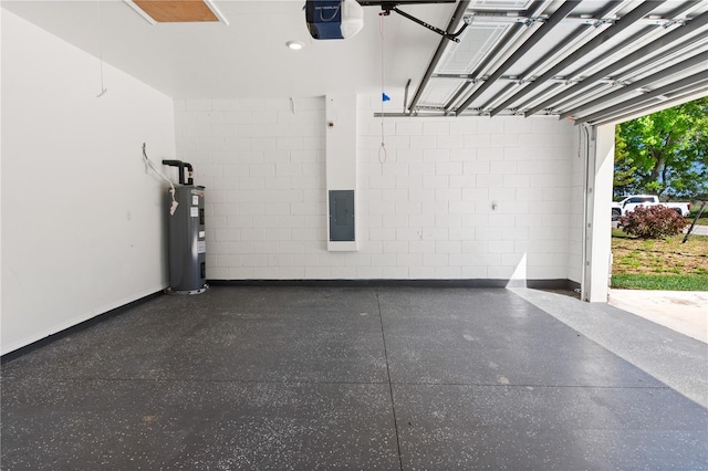 garage with electric panel, electric water heater, a garage door opener, and concrete block wall