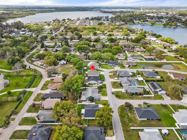 bird's eye view with a residential view and a water view