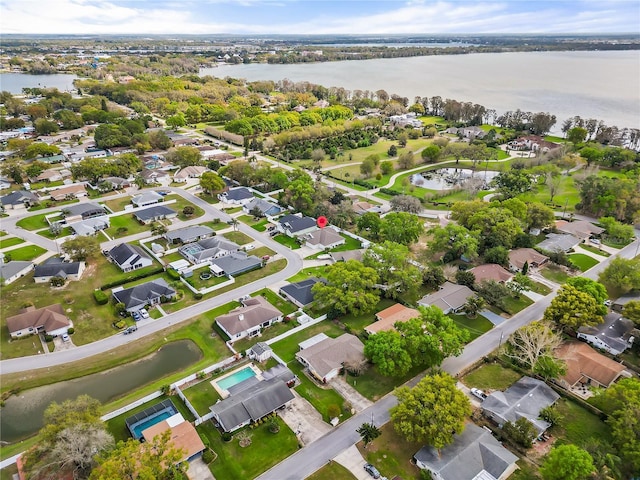 birds eye view of property featuring a water view and a residential view