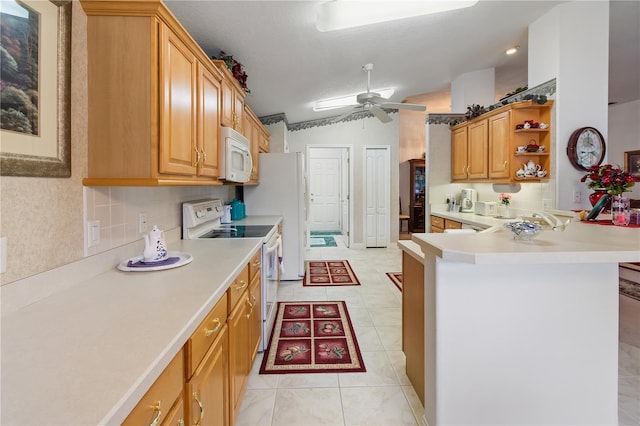 kitchen featuring tasteful backsplash, light countertops, vaulted ceiling, ceiling fan, and white appliances