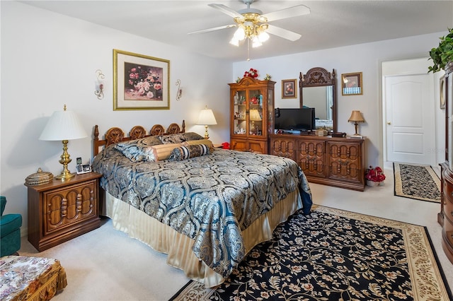 carpeted bedroom with ceiling fan