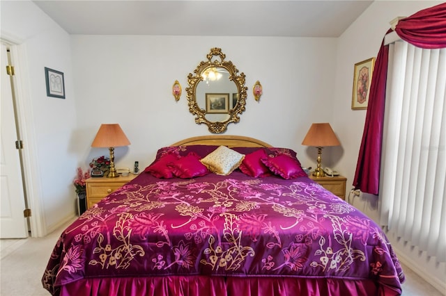 bedroom featuring carpet and baseboards