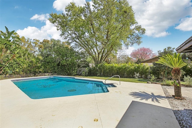 view of pool featuring a fenced backyard, a fenced in pool, and a patio