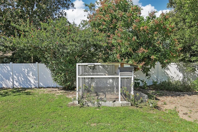 view of yard with an outbuilding and a fenced backyard