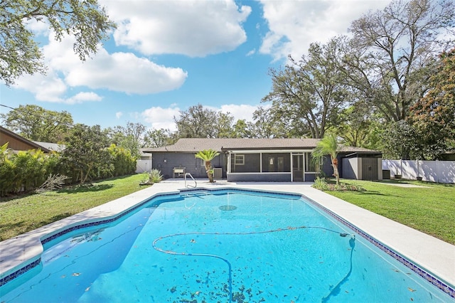 view of swimming pool with a fenced in pool, a sunroom, a fenced backyard, and a yard