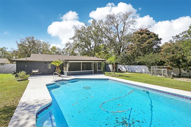 view of swimming pool with a yard, a fenced backyard, a sunroom, and a fenced in pool