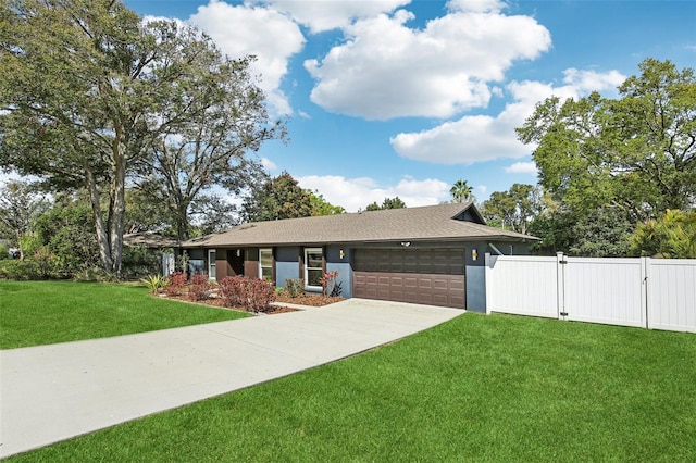 ranch-style house featuring stucco siding, an attached garage, a gate, driveway, and a front lawn