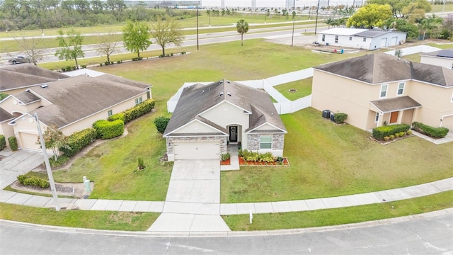 birds eye view of property with a residential view