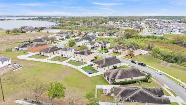 bird's eye view featuring a residential view and a water view